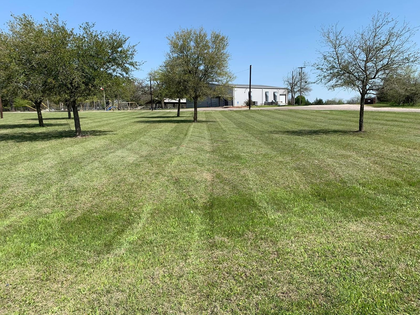 Freshly mowed property with clean mowing lines